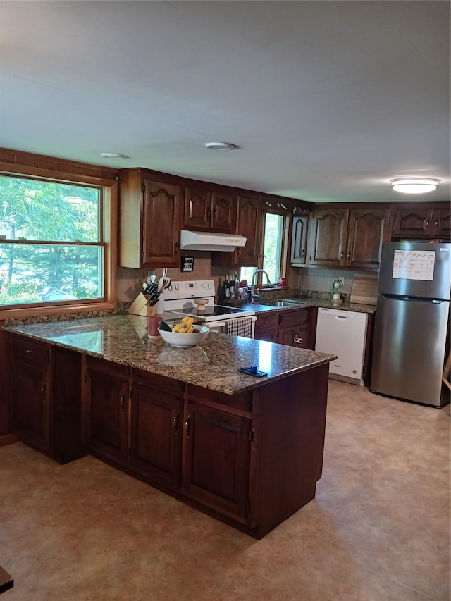 1427 Rte 44 55, Clintondale, NY 12515 - kitchen featuring white appliances, under cabinet range hood, dark stone counters, a peninsula, and dark brown cabinetry
