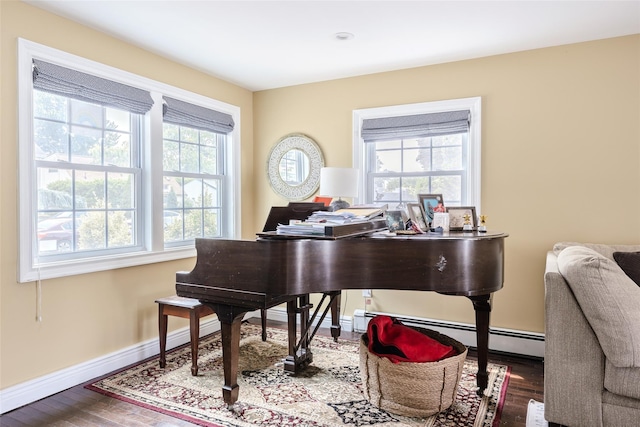 59 Acre Ln, Hicksville, NY 11801 - sitting room with wood finished floors and a baseboard radiator