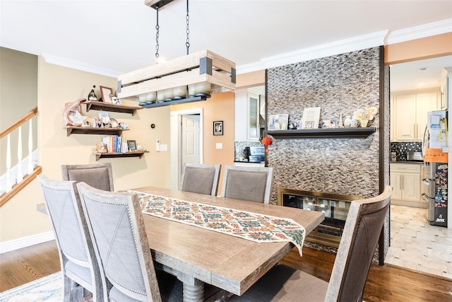 59 Acre Ln, Hicksville, NY 11801 - dining space featuring stairs, crown molding, and wood finished floors