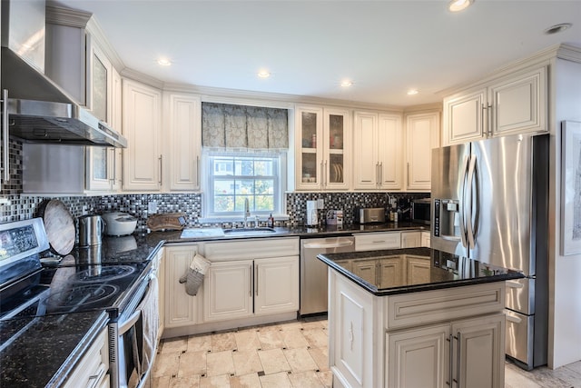 59 Acre Ln, Hicksville, NY 11801 - kitchen with appliances with stainless steel finishes, wall chimney exhaust hood, decorative backsplash, a center island, and glass insert cabinets