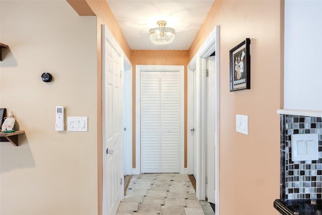 59 Acre Ln, Hicksville, NY 11801 - hall with a chandelier and baseboards