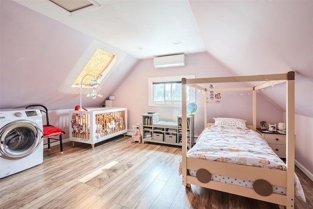 59 Acre Ln, Hicksville, NY 11801 - bedroom with washer / dryer, a wall mounted AC, wood finished floors, and lofted ceiling