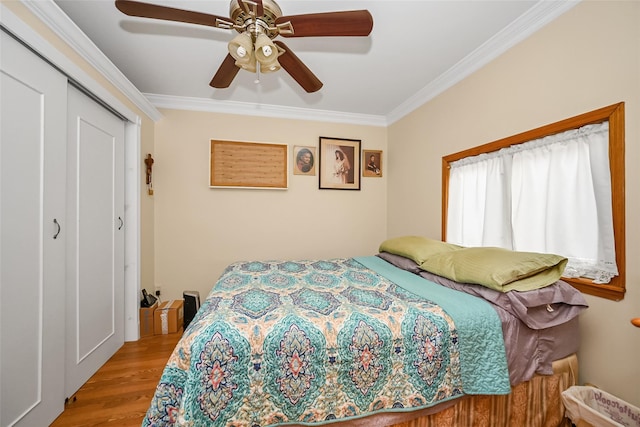 92-05 218th Pl, Queens Village, NY 11428 - bedroom featuring ornamental molding, wood finished floors, a closet, and a ceiling fan