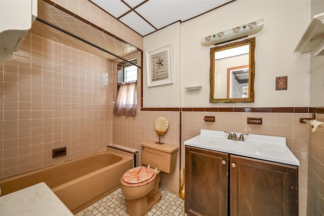92-05 218th Pl, Queens Village, NY 11428 - full bathroom featuring tile walls, vanity, and a wainscoted wall