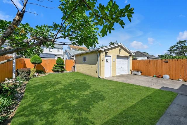 92-05 218th Pl, Queens Village, NY 11428 - fenced backyard featuring driveway, a detached garage, and an outdoor structure