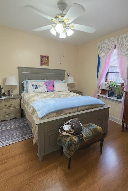 3545 81st St Unit C2, Jackson Heights, NY 11372 - bedroom with light wood-type flooring and a ceiling fan