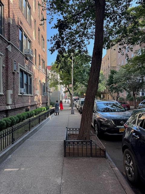 3545 81st St Unit C2, Jackson Heights, NY 11372 - view of asphalt road with sidewalks and curbs