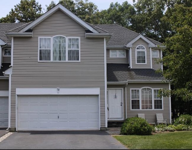 33 Sunflower Ridge Rd, South Setauket, NY 11720 - traditional-style house with asphalt driveway, an attached garage, and a shingled roof
