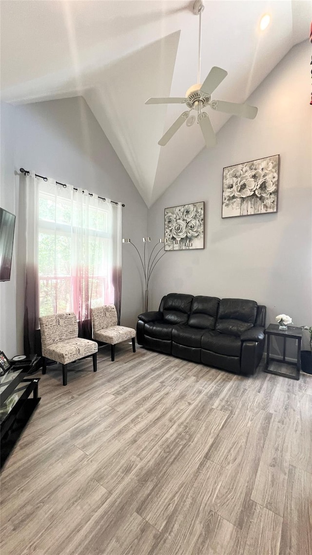 33 Sunflower Ridge Rd, South Setauket, NY 11720 - living room featuring light wood finished floors, a ceiling fan, and high vaulted ceiling
