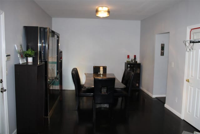33 Sunflower Ridge Rd, South Setauket, NY 11720 - dining area with baseboards and dark wood-style flooring