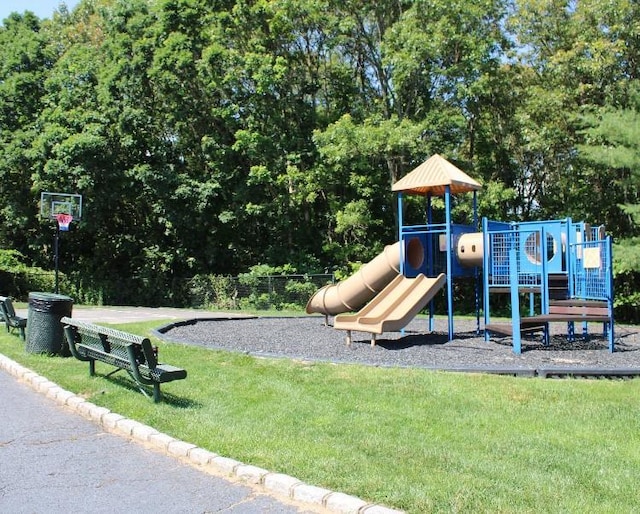 33 Sunflower Ridge Rd, South Setauket, NY 11720 - community play area featuring a lawn and view of wooded area