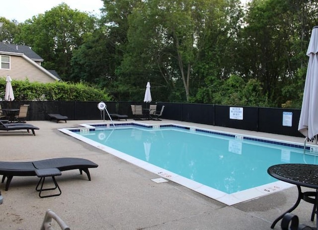 33 Sunflower Ridge Rd, South Setauket, NY 11720 - community pool with a patio area and view of wooded area