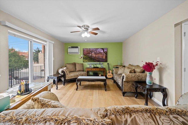 1935 Holland Ave, Bronx, NY 10462 - living area featuring ceiling fan, a wall unit AC, and light wood-style floors