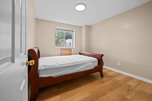 1935 Holland Ave, Bronx, NY 10462 - bedroom with light wood-type flooring and baseboards