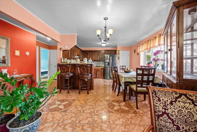 1935 Holland Ave, Bronx, NY 10462 - dining area with a chandelier and light tile patterned floors