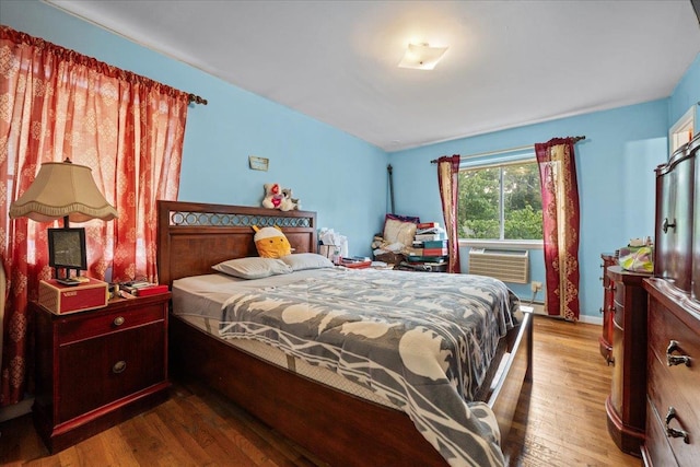 1935 Holland Ave, Bronx, NY 10462 - bedroom with wood finished floors, a baseboard radiator, and cooling unit