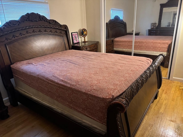21531 Murdock Ave, Queens Village, NY 11429 - bedroom with hardwood / wood-style floors, a closet, and multiple windows