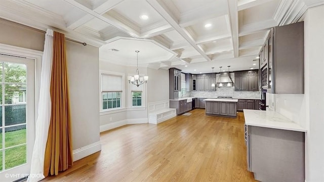 60 E Minerva Rd, Lindenhurst, NY 11757 - kitchen with extractor fan, a chandelier, gray cabinetry, decorative backsplash, and beamed ceiling