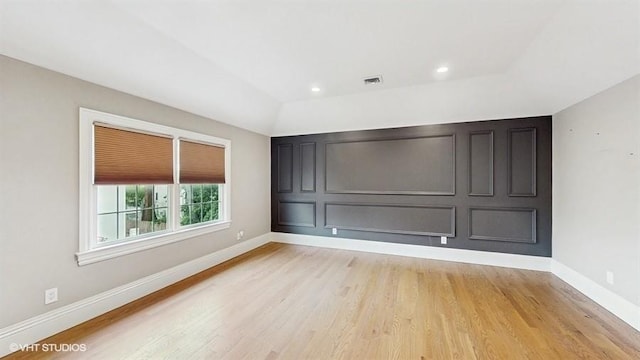 60 E Minerva Rd, Lindenhurst, NY 11757 - spare room with light wood finished floors and recessed lighting