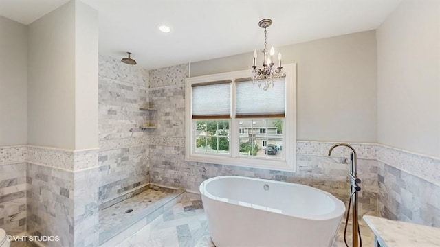 60 E Minerva Rd, Lindenhurst, NY 11757 - full bath featuring tile walls, a soaking tub, a chandelier, a tile shower, and wainscoting