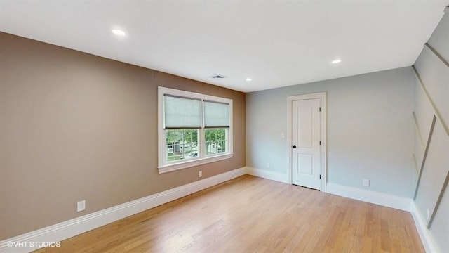 60 E Minerva Rd, Lindenhurst, NY 11757 - spare room with light wood finished floors and recessed lighting