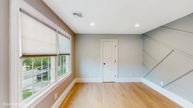 60 E Minerva Rd, Lindenhurst, NY 11757 - empty room featuring light wood finished floors and recessed lighting