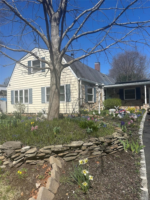 4 Bridle Path, Farmingville, NY 11738 - view of front of house with a chimney and stone siding