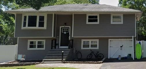 18 Burney Blvd, Mastic, NY 11950 - raised ranch with a garage and driveway