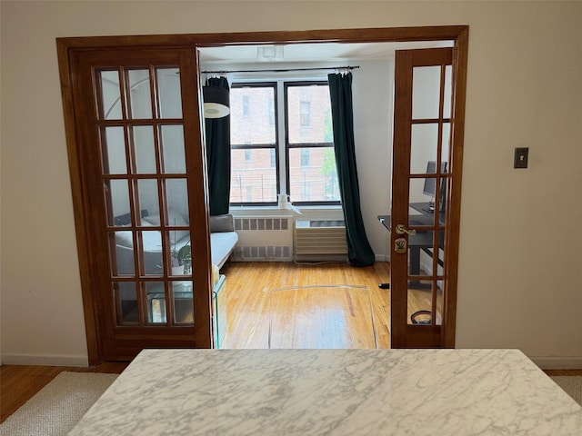 100-25 Queens Blvd Unit 3D, Forest Hills, NY 11375 - bedroom featuring radiator and wood finished floors