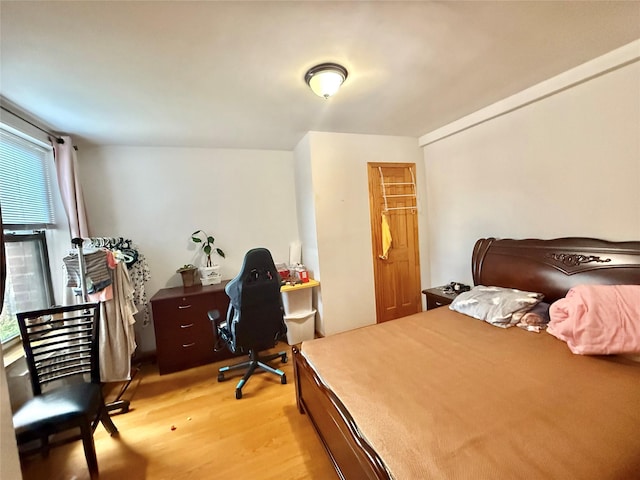 138-70 Elder Ave Unit 3A, Flushing, NY 11355 - bedroom featuring light wood-style floors, a desk, and a closet