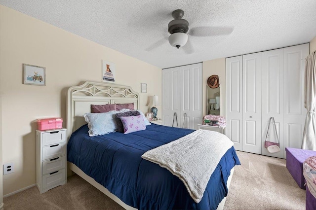 216UNITM Springmeadow Dr, Holbrook, NY 11741 - bedroom featuring light colored carpet, multiple closets, a textured ceiling, and ceiling fan
