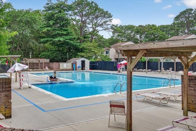 216UNITM Springmeadow Dr, Holbrook, NY 11741 - community pool with a patio and view of scattered trees