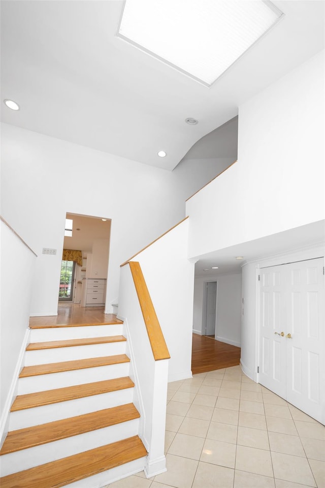18 Sutton Ter, Jericho, NY 11753 - staircase with tile patterned flooring and recessed lighting