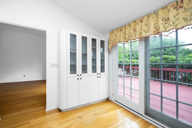 18 Sutton Ter, Jericho, NY 11753 - spare room with vaulted ceiling and light wood finished floors