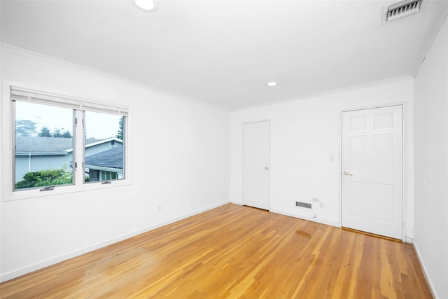 18 Sutton Ter, Jericho, NY 11753 - empty room featuring light wood finished floors, ornamental molding, and recessed lighting