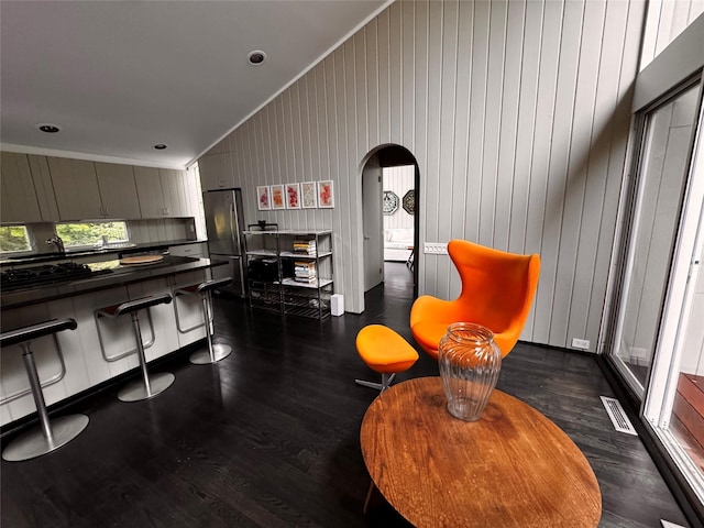 487 Tarpon Walk, Fire Island Pines, NY 11782 - living room featuring dark wood-type flooring, arched walkways, and ornamental molding
