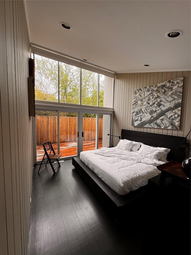 487 Tarpon Walk, Fire Island Pines, NY 11782 - bedroom featuring dark wood-type flooring and wooden walls