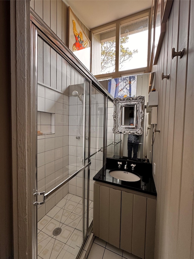 487 Tarpon Walk, Fire Island Pines, NY 11782 - bathroom with a stall shower, vanity, and tile patterned flooring