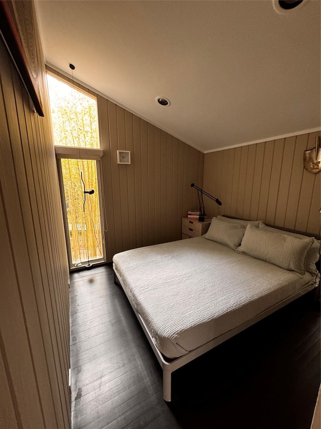 487 Tarpon Walk, Fire Island Pines, NY 11782 - bedroom featuring dark wood finished floors, lofted ceiling, and wooden walls