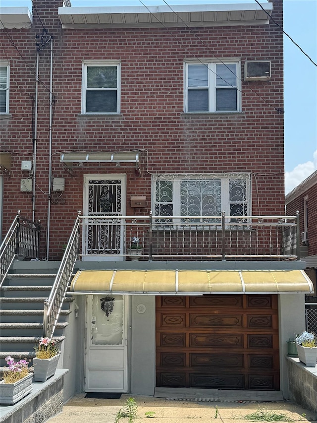 2896 Coddington Ave, Bronx, NY 10461 - traditional home with a balcony, a garage, and brick siding