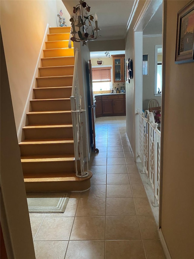2896 Coddington Ave, Bronx, NY 10461 - stairs featuring ornamental molding, tile patterned flooring, and a chandelier