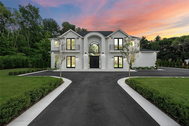 2 Maple Way, Woodbury, NY 11797 - french country home with a balcony, french doors, and a front yard