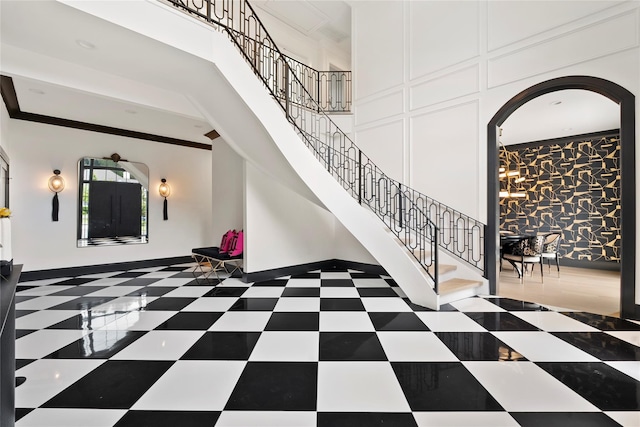 2 Maple Way, Woodbury, NY 11797 - foyer entrance with arched walkways, stairs, and a high ceiling