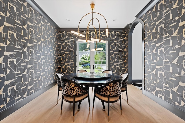 2 Maple Way, Woodbury, NY 11797 - dining room with light wood-type flooring, wallpapered walls, and crown molding