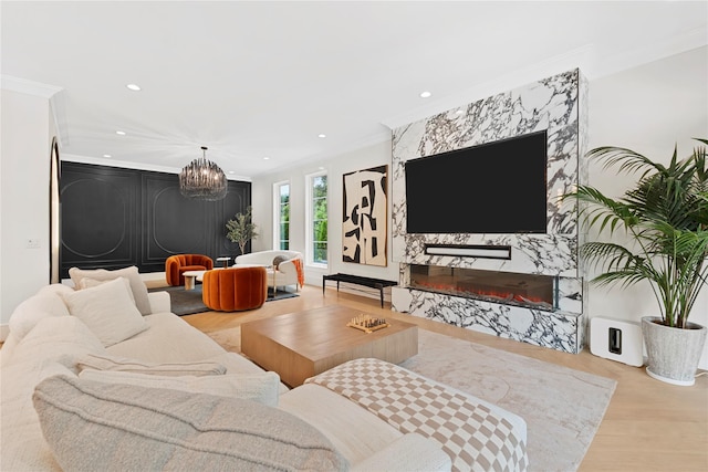 2 Maple Way, Woodbury, NY 11797 - living room featuring ornamental molding, wood finished floors, a chandelier, and recessed lighting