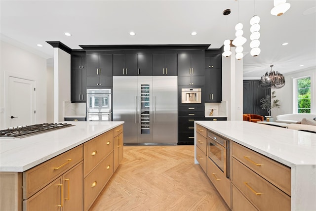 2 Maple Way, Woodbury, NY 11797 - kitchen featuring appliances with stainless steel finishes, a spacious island, dark cabinetry, a chandelier, and recessed lighting
