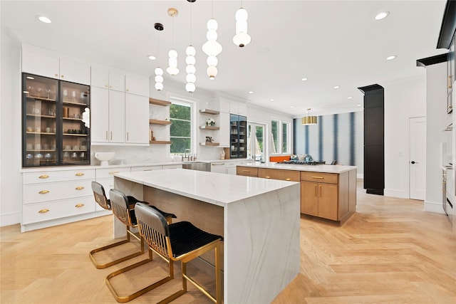 2 Maple Way, Woodbury, NY 11797 - kitchen with open shelves, a center island, recessed lighting, white cabinetry, and decorative light fixtures