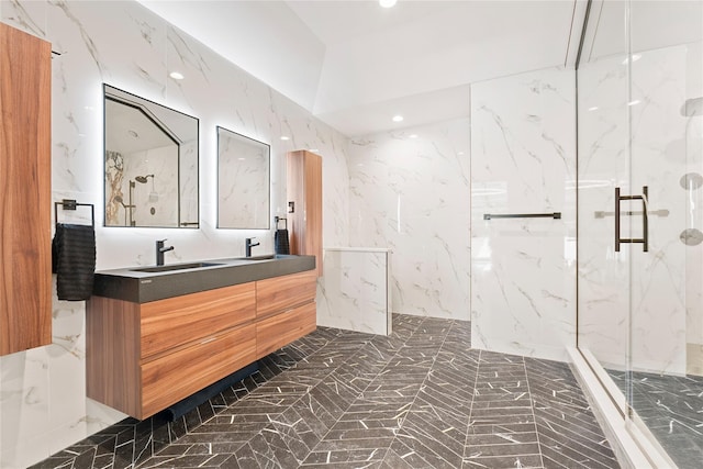 2 Maple Way, Woodbury, NY 11797 - full bath featuring a marble finish shower, marble tiled flooring, double vanity, recessed lighting, and stone wall