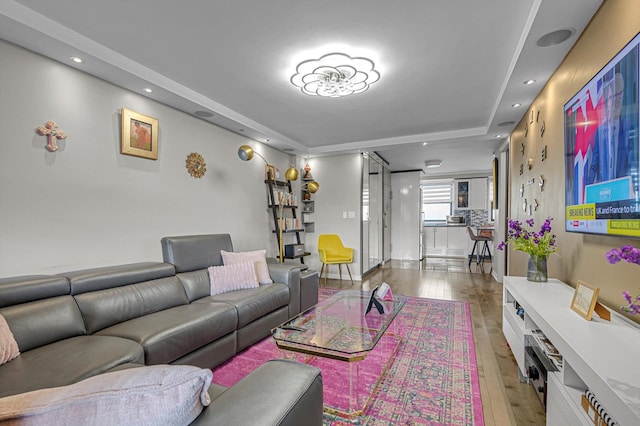 61-45 98th St Unit 11G, Rego Park, NY 11374 - living area with wood-type flooring, a tray ceiling, and recessed lighting