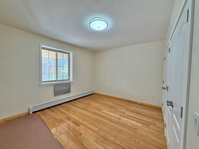1604 Robertson Pl, Bronx, NY 10465 - unfurnished room featuring a baseboard radiator and light wood-type flooring